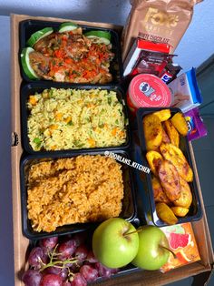 an open box filled with lots of food next to some fruit and veggies