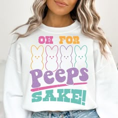 a woman wearing a sweatshirt that says oh for peeps sake