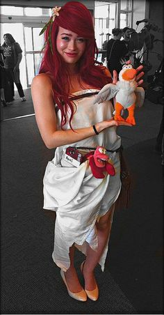 a woman in a white dress holding a stuffed animal