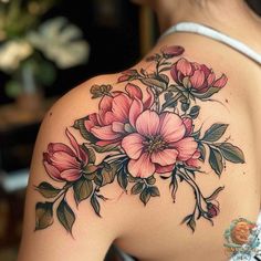 a woman's shoulder with flowers on it