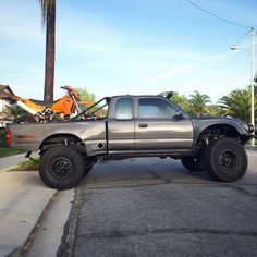 the truck is parked on the side of the road