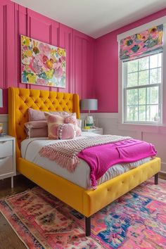 a bedroom with pink walls and yellow headboard