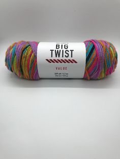 a skein of multicolored yarn sitting on top of a white surface