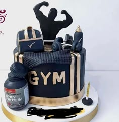 a cake that is decorated to look like a bodybuilding gym outfit and some tools