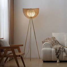 a living room with a couch, chair and floor lamp