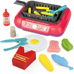 a play food set with eggs, hotdogs and other kitchen utensils