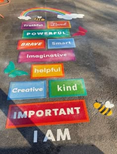 the sidewalk has been painted with different words and symbols on it, including beehive