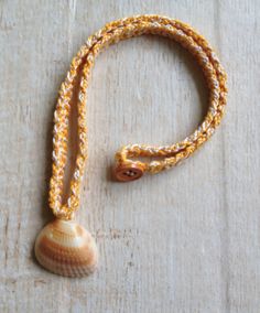 "These sweet shell necklaces are crocheted with mercerized cotton and have a button closure. They are perfect to wear to the beach! The shells were found on my local beach in Jupiter, Florida. Wash by hand with a small amount of liquid soap and lay flat to dry. The necklaces are between 18\" and 19-1/2\" inches in length, the exact measurement of each necklace is indicated in the necklace choice box. The width of the tan/ecru necklace is 3/8\" and the other necklaces are 1/4\" wide. The shells a Summer Beach Crochet Jewelry, Summer Crochet Jewelry For Beach, Summer Crochet Beach Jewelry, Adjustable Crochet Necklace For Beach, Bohemian Crochet Necklace For Beach, Bohemian Crochet Necklaces For Beach, Adjustable Crochet Necklaces For The Beach, Surfer Girl Costume, Mermaid Shell Necklace