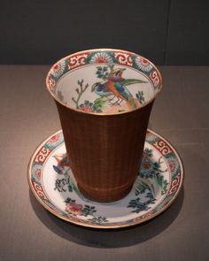 a cup and saucer sitting on top of each other