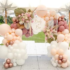 an outdoor event with balloons and decorations