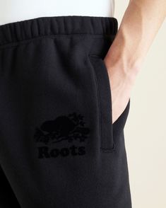 We've been perfecting sweats since 1979. Our Original Sweatpants are designed to last, and made for snuggling into. Also available in Tall and Short inseam lengths. Ultra-soft fleece Organic cotton & recycled materials Classic fit Drawstring waistband Elasticated cuffs Two welt pockets Flocked iconic logo at front left ABOUT Black pepper: 60% organic cotton, 40% recycled polyester fleece Solid colours: 80% organic cotton, 20% recycled polyester fleece SIZE & FIT Model is wearing: medium Model Me Black Sweatpants With Logo Detail For Loungewear, Black Fleece Sweatpants Sportswear, Black Cotton Sportswear Sweatpants, Black Sweatpants Outfit, Roots Sweatpants, Sporty Black 4-way Stretch Sweatpants, Tall And Short, Slim Sweatpants, Ironing Machine