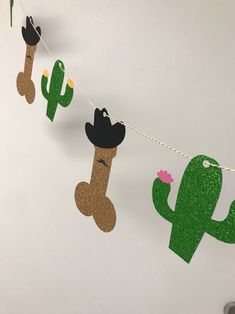 cactus and cowboy hats hanging from a string