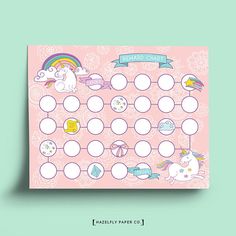 a pink board game with unicorns and rainbows on the front, surrounded by white circles