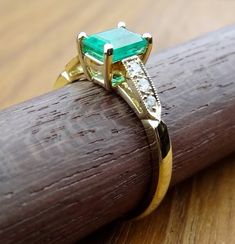 We designed and handmade this very petite ring. The center 6.3 x 4.4 mm Natural Emerald weight is .67cts. With 6 diamonds TCW is .10cts. It is made in 18k natural yellow gold Ring size is 6 We can make it any size from 5-7 and you still be able to return it within the listed time frame. Sizing outside of that range requires a resize fee if for any reason the ring is retuned. Ring sizing may add additional handling time. We love this ring because it represents the way jewelry should be made with Anniversary Jewelry Ring With Certificate Of Authenticity, Anniversary Ring With Certificate Of Authenticity, Fine Jewelry With Certificate Of Authenticity As Gift, Fine Jewelry Gift With Certificate Of Authenticity, Fine Jewelry As A Gift With Certificate Of Authenticity, Art Deco Gia Certified Emerald Ring As Gift, Gia Certified Art Deco Emerald Ring Gift, Elegant Rings With Certificate Of Authenticity As Gift, Anniversary Diamond Jewelry With Certificate Of Authenticity