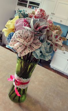 a vase filled with flowers on top of a counter