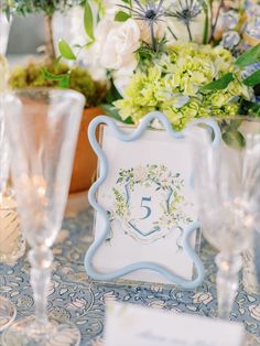 the table is decorated with flowers and candles