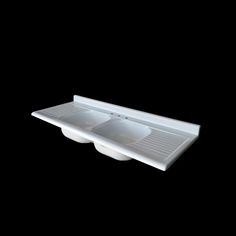 two white sinks sitting on top of a black counter