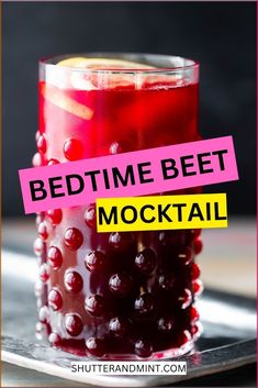 a red drink in a glass with the words bedtime beet cocktail