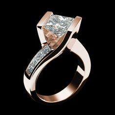 a white gold ring with a princess cut diamond