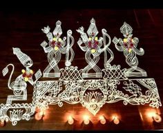 an intricately designed light sculpture with candles