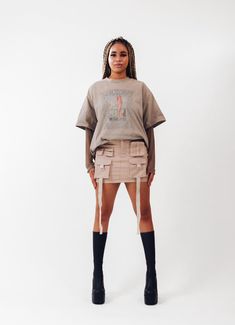 Get ready to amp up your streetwear game with our freshest creation - introducing the ACS Mini Cargo Skirt! We've poured our techwear and streetwear passion into this beauty, and we can't wait for you to experience it firsthand. *Intricate Design, Striking Look: Dive into the dynamic front design, featuring cargo pockets and hanging straps. This combination crafts a unique silhouette that effortlessly catches attention, making each step a statement. *Beige Colorway: Elevate your wardrobe with the versatile light beige hue. It effortlessly complements your existing collection, offering a canvas for endless creative pairings. *Perfect Mini Length: The ACS Mini Cargo Skirt strikes the ideal balance between mini and comfort  *Customized Comfort, Adjustable Waistband: Experience the luxury of a Edgy Mini Skirt For Streetwear, Fitted Denim Mini Skirt For Streetwear, Edgy Cargo Skirt With Pockets For Streetwear, Y2k Style Skort For Streetwear In Spring, Y2k Mini Skirt For Streetwear, Streetwear Mini Skort With Pockets, Y2k Style Cargo Skirt For Spring Streetwear, Y2k Mini Skort For Streetwear, Y2k Denim Mini Skirt For Streetwear