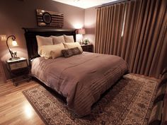 a bedroom with a large bed and wooden floors