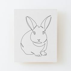 a black and white drawing of a rabbit