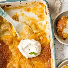 a casserole dish filled with cheese and sour cream