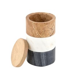 three different types of marble and wood containers