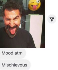 a man with his tongue out and an emoticive message above him that says mood atm misshievous