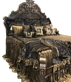 an ornate bed with gold and black decor