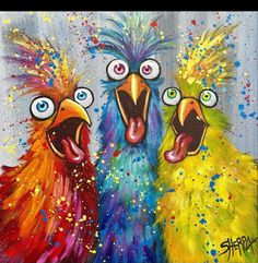 two colorful birds are standing next to each other with their mouths open and eyes wide open