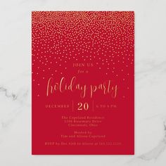 a red and gold holiday party card with confetti on the top, in front of a marble background