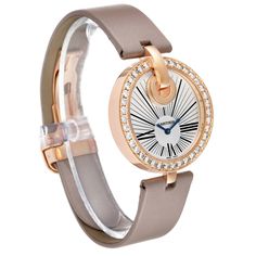 Cartier Captive Rose Gold Diamond Ladies Watch WG600011. Quartz movement. . 18k rose gold original Cartier factory diamond bezel. Scratch resistant sapphire crystal. Silver guilloche dial with sunburst finish and black Roman numerals at 3, 6, and 9 o'clock. Blued steel sword shaped hands. Beige leather strap with 18k rose gold deployant clasp. Luxury Cartier Watch With Brilliant Cut, Luxury Round Cartier Watches, Luxury Rose Gold Watches With Diamond Accents, Luxury Watch Accessories With Diamond Hour Markers, Designer Diamond Watch With Diamond Hour Markers, Modern Rose Gold Round Diamond Watch, Luxury Watches With Diamond Hour Markers, Luxury Watch With Diamond Hour Markers, Luxury Round Watch With Diamond Hour Markers