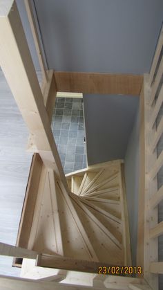 an overhead view of a spiral staircase in a house