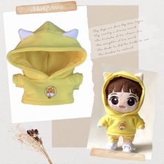 the doll is wearing a yellow hoodie