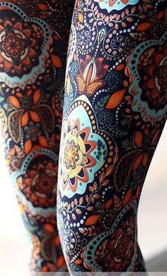 the legs of a woman wearing patterned leggings