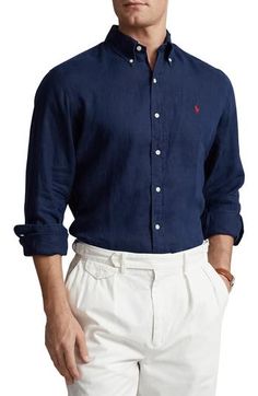 Soft, lightly rumpled linen brings exceptional comfort to a button-down shirt tailored in a slim fit and finished with a contrast embroidered logo. 33" length; 52" chest (size XX-Large) Front button closure Button-down collar Long sleeves with button cuffs 100% linen Machine wash, tumble dry Imported Fitted Linen Shirt With Button Closure, Fitted Linen Shirt With Placket, Ralph Lauren Slim Fit, Dyed Linen, Linen Short, Tailored Shirts, Button Down Collar, Chest Size, Sports Shirts