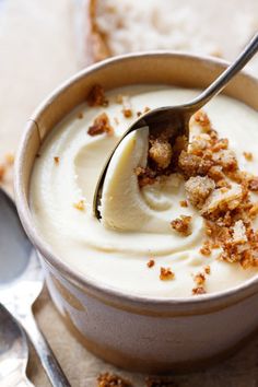 a spoon with some food in it on a table