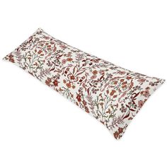 a white and brown floral print pillow on a white background