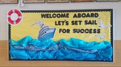 a welcome aboard sign on the wall in a classroom