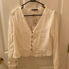 White Long Sleeve Top From Zara With Button Detail. Nwt! Size M Spring White Blouse With Snap Buttons, White Blouse With Snap Buttons For Spring, White Zara Blouse With Buttons, White Zara Blouse With Button Closure, Zara White Top With Buttons, Zara Blouse With Buttons For Day Out, Zara V-neck Tops With Buttons, Zara Lace Top, Zara Basics