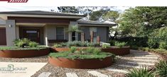 a house that has some plants in the front yard