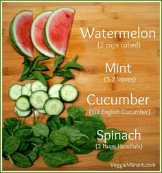 watermelon, cucumber and spinach on a cutting board