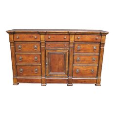 an old wooden dresser with many drawers and knobs on it's doors, isolated against a white background