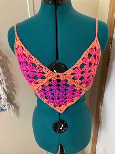 a mannequin with a crocheted top on it