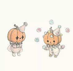 two little pumpkins wearing costumes with bubbles in the air and one has a birthday hat on