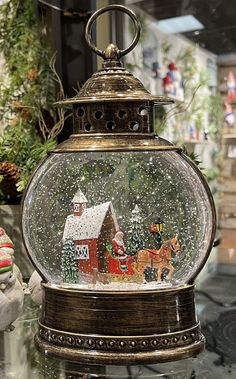 there is a snow globe with a christmas scene in it