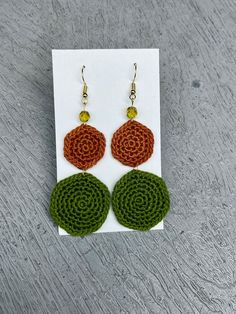 Handmade crochet earrings with glass beads. Lovely green and ochre colors. stainless steel wires. Green Macrame Earrings As A Gift, Green Macrame Earrings For Gift, Green Macrame Dangle Earrings, Earthy Handmade Multicolor Earrings, Handmade Green Round Earrings, Stainless Steel Wire, Handmade Crochet, Favorite Jewelry, Jewelry Earrings Dangle