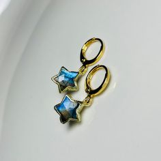 ✵ Listing is for one pair of  earrings ✵10 x 10mm Labradorite  ✵Gold-plated charm ✵12mm x 14mm 24k gold-plated earrings ✵Lever-back small hoops ✵Please note: these gemstones are natural, therefore, will be unique in size, color, and texture. However, I will do my best to find pair up the most similar stones ✵Packaged in gold tissue paper with recyclable earring card holders, receipt included upon request  ✵Dainty, classy, and minimalistic style ✵Get the set! Link below to the necklaces: https:// Celestial Star-shaped Hypoallergenic Earrings, Celestial Star Hypoallergenic Earrings, Celestial Earrings With Star Charm As Gift, Handmade Dainty Star Earrings, Yellow Gold Star Huggie Earrings For Gift, Star-shaped Huggie Earrings As A Gift, Round Star Charm Earrings For Gift, Round Star Charm Earrings, Celestial Huggie Earrings As Gift